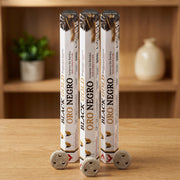 Aum Black and Gold bambooless incense sticks 3-pack with 3 metal coil holders on light oak wood surface
