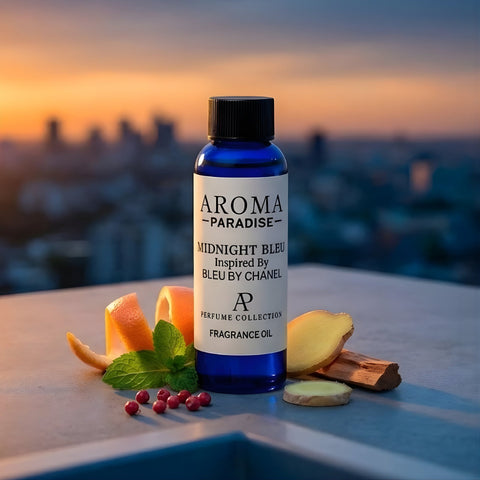 Aroma Paradise fragrance oil bottle with ingredients on a rooftop at sunset