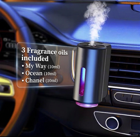 Smart Car Diffuser clipped to car vent with mist and 3 included fragrance oils listed - Aroma Paradise