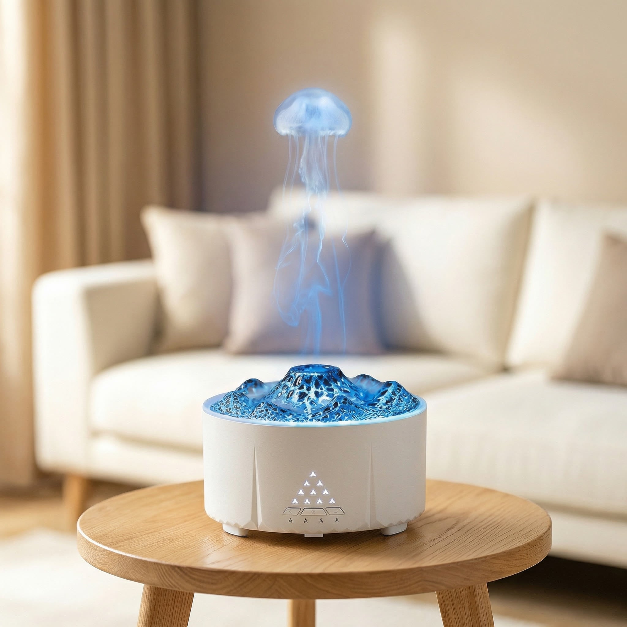 White jellyfish diffuser with blue tentacle mist column rising from ocean-textured top - Aroma Paradise
