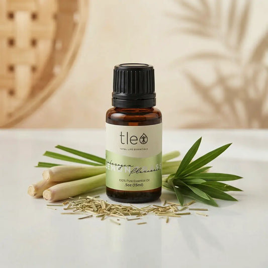 Tleio essential oil bottle with lemongrass on a light background