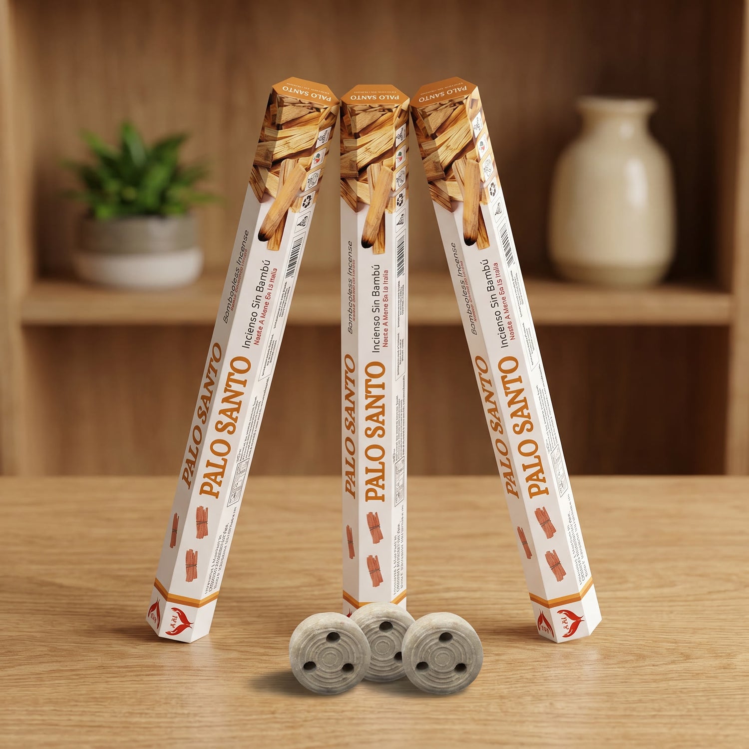 Aum Palo Santo bambooless incense sticks 3-pack with 3 metal coil holders on light oak wood surface