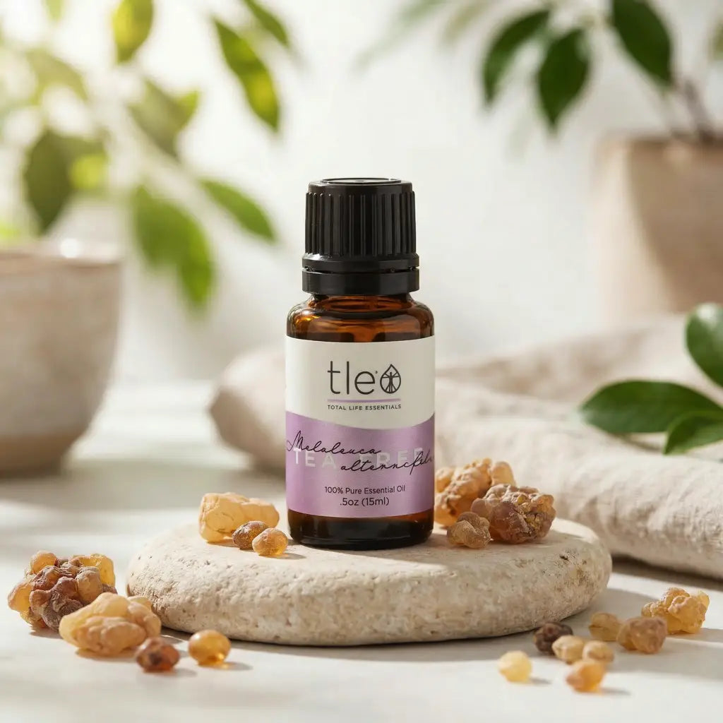Bottle of tle essential oil with frankincense resin on a stone surface with a natural background