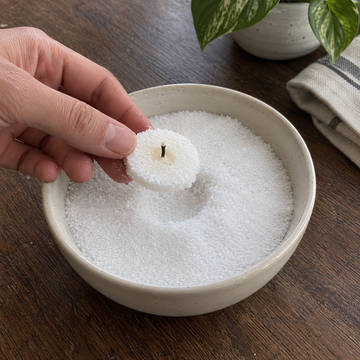 Resetting candle sand after the wax has cooled