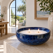 Candle sand in a cobalt bowl in a coastal home