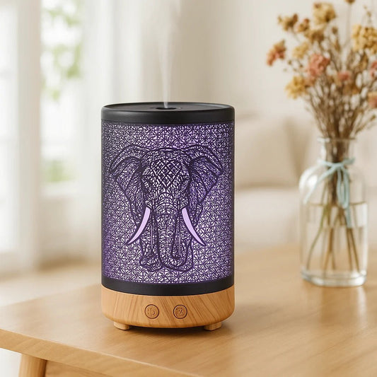 Decorative diffuser with elephant design on a wooden table