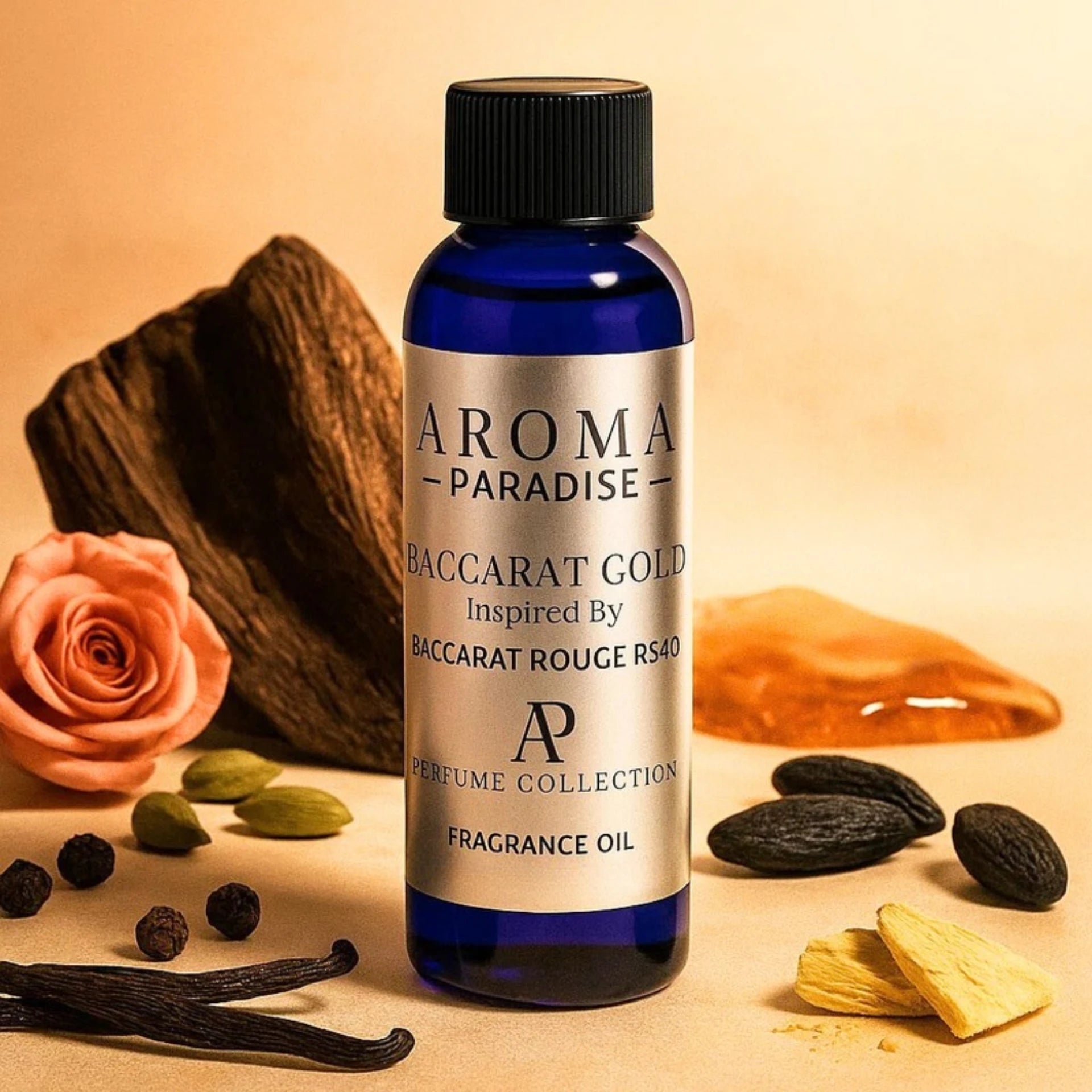 Bottle of Aroma Paradise Baccarat Gold fragrance oil with vanilla beans, rose, and cardamom on a beige background
