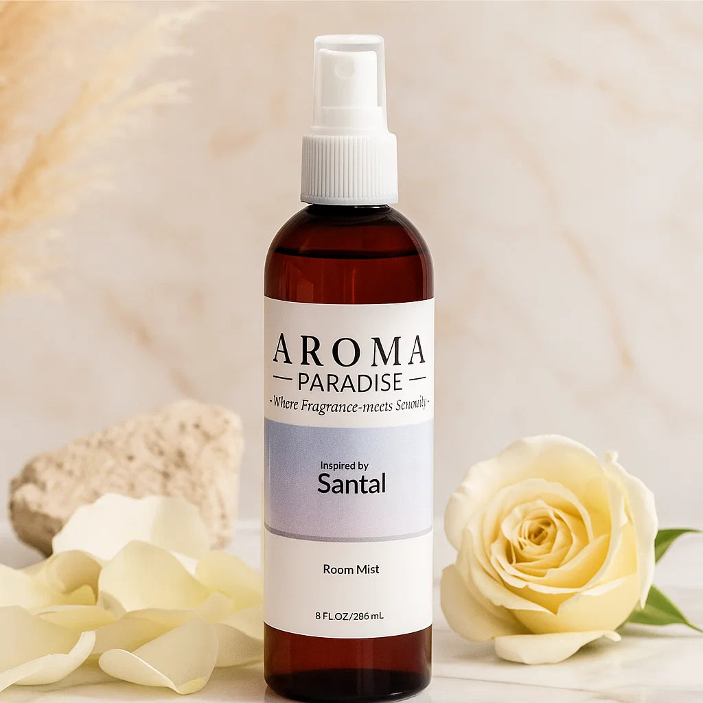 Aroma Paradise Santal room mist bottle with a white rose and petals on a beige background