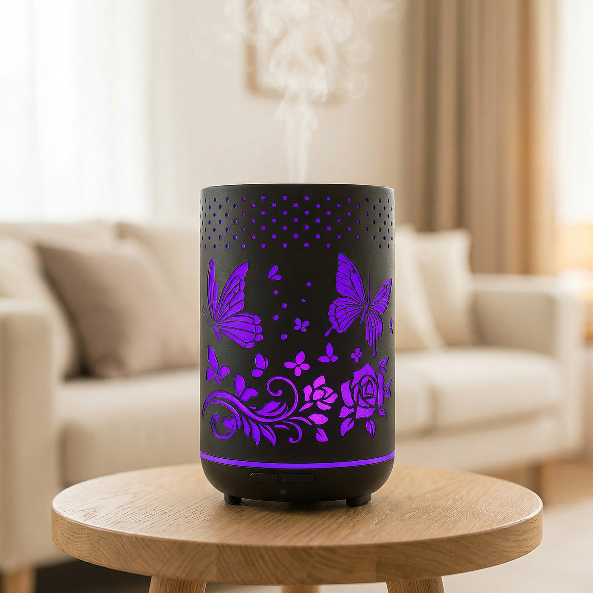Black metal diffuser with purple LED butterfly and rose cutout patterns misting on wood table, Aroma Paradise