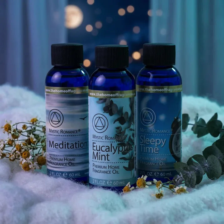 Sleepy Time Fragrance Oil Set with chamomile and eucalyptus on soft white blanket, moonlit scene - Aroma Paradise