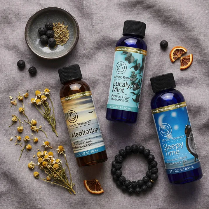 Sleepy Time Fragrance Oil Set flat lay with chamomile, dried orange, and lava bead bracelet on linen - Aroma Paradise