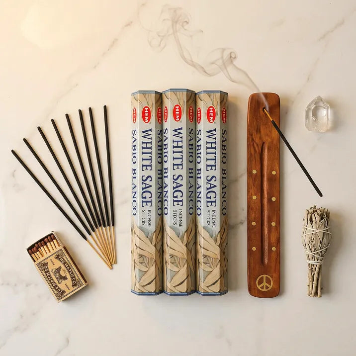Hem White Sage incense flat lay with three tubes, wooden holder, sticks, sage bundle on marble - Aroma Paradise