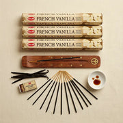 Hem French Vanilla incense flat lay with four tubes, wooden holder, sticks, vanilla beans on linen - Aroma Paradise