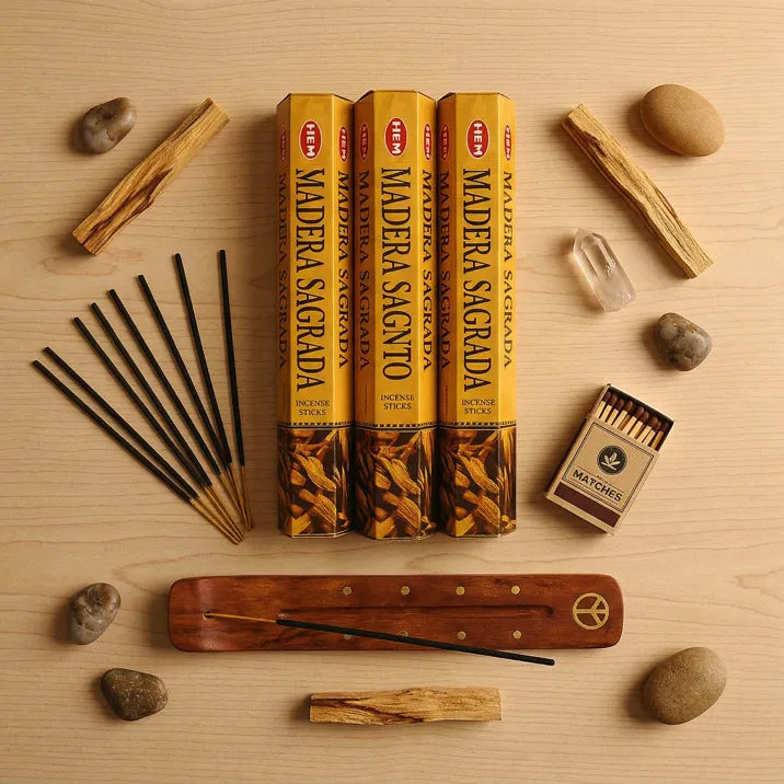 Hem Palo Santo gift set flat lay with three yellow boxes, wooden holder, palo santo sticks, and matches - Aroma Paradise