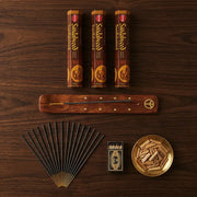 Hem Sandalwood gift set flat lay with three brown boxes, wooden holder, sticks, and sandalwood chips - Aroma Paradise