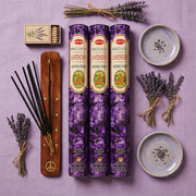 Hem Lavender gift set flat lay with three purple boxes, wooden holder, dried lavender, and ceramic dishes - Aroma Paradise