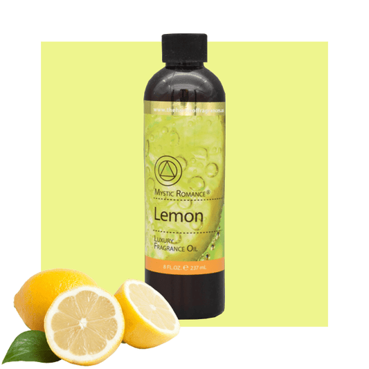 A bottle of Mystic Romance Lemon fragrance oil with a yellow label, accompanied by a image of fresh lemons and leaves on a yellow background.
