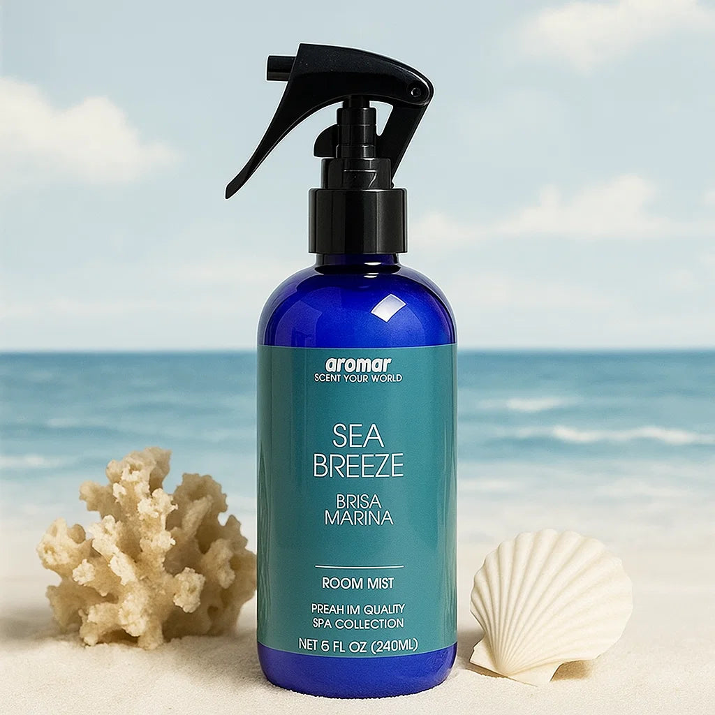 Blue room mist bottle labeled 'Sea Breeze' with a beach background
