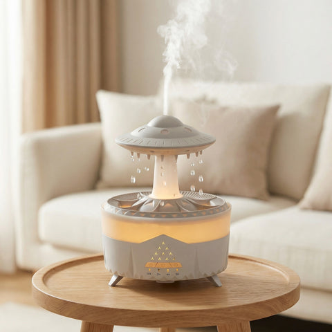 UFO-shaped raindrop diffuser with cascading water drops and warm LED glow in living room - Aroma Paradise