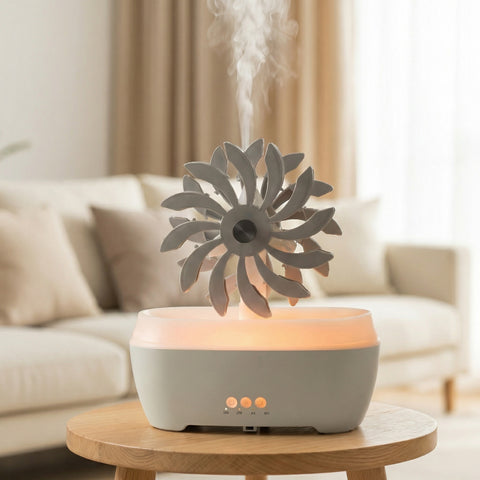 Gray Windmill Spa Diffuser with spinning petal top and warm LED glow misting on wood table - Aroma Paradise