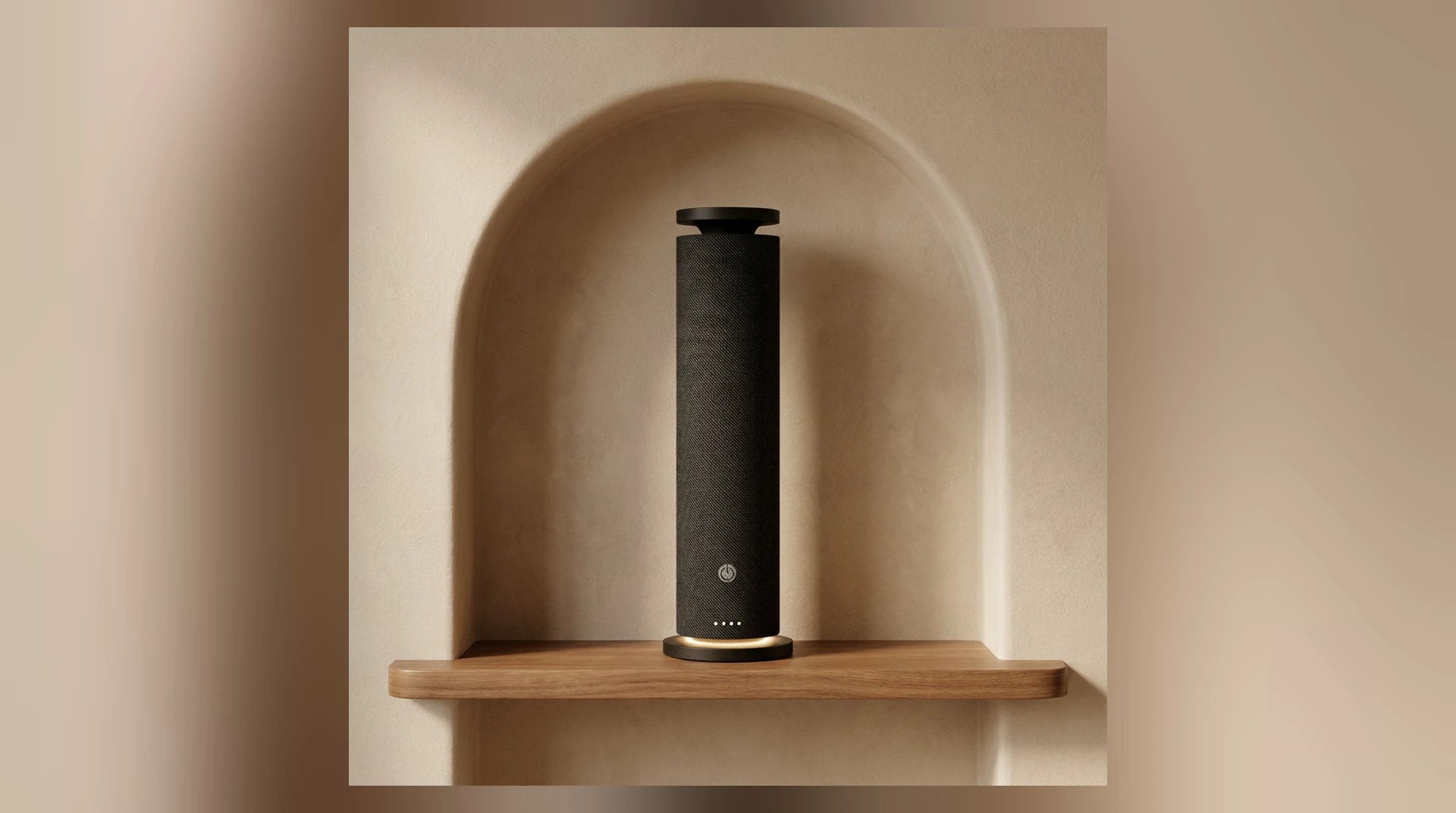Black Fabric Tower waterless diffuser in a warm arched wall niche